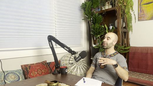 The Del be Del studio: the host's chair, the boom mic, the plants